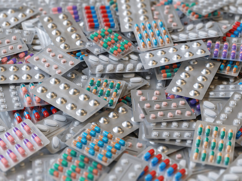 Big heap of various pills and tablets packs and blisters. Illustrating Structured medication reviews: How they are working in PCNs