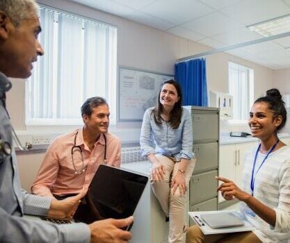Team of healthcare professionals talking - a Place-level approach